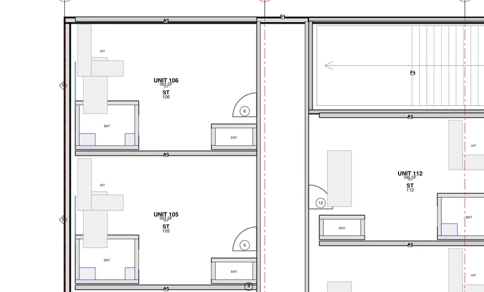 A detail of sheet A-101 at readable size: units 105 and 106 with kitchen, bath and entry tagged, numbered door swings, wall-type callouts reading A5, grid bubbles, and the stair core beside them.